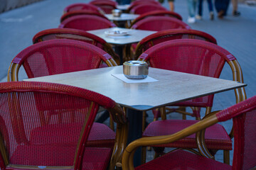 table and chairs at a street cafe in the old town