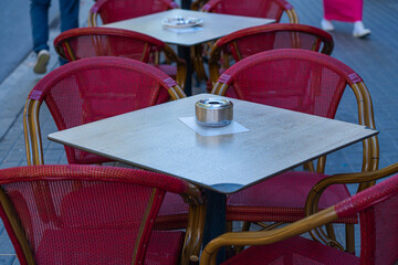 table and chairs at a street cafe in the old town