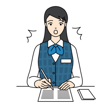 Surprised female office worker making a mistake while writing