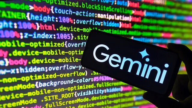 Smartphone displaying Gemini app with coding background