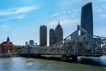 Obraz premium Tianjin Jiefang Bridge Over Haihe River with Skyscrapers