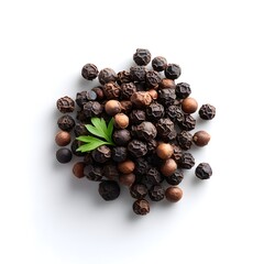 Obraz premium Pile of Whole Black Peppercorns with a Fresh Green Garnish Isolated on White