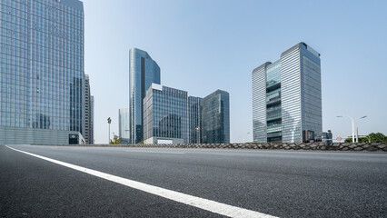 Modern skyscrapers with empty asphalt road