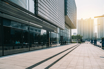 Modern Urban Building with Glass Facade and Pedestrian Path