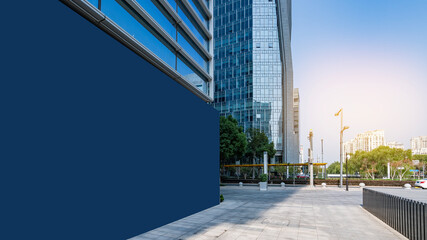 Fototapeta premium Modern Urban Building with Empty Blue Wall for Advertising