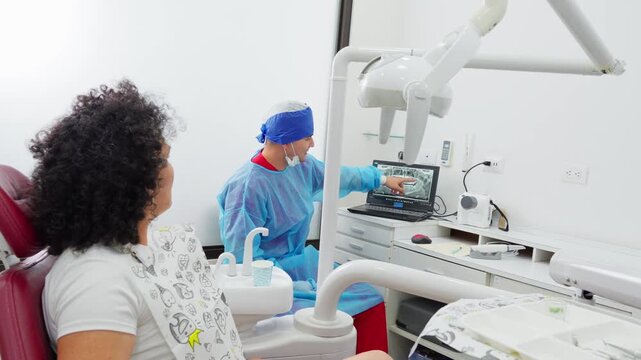 Dentist explaining panoramic x-ray to patient