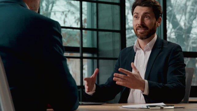 Caucasian businessman consulting client manager advise customer in modern office consultant trader bank worker professional at business meeting men guys males offer investment insurance recommendation