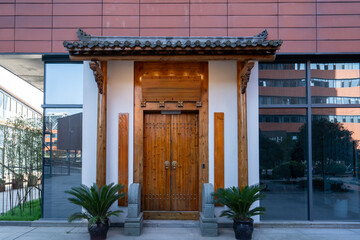 Traditional Chinese Gate on Modern Building Exterior