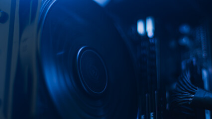 CPU fan in motion with blue LED lighting, liquid cooling concept and thermal performance