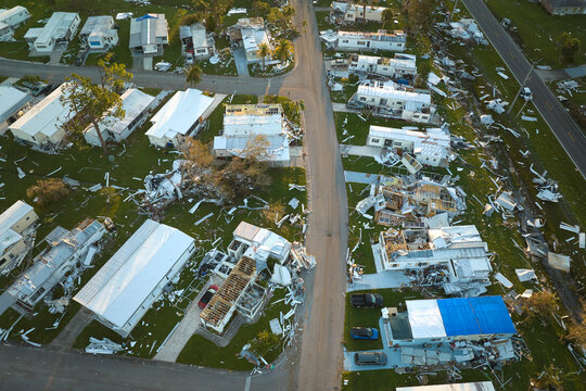Destroyed by hurricane Ian suburban houses in Florida mobile home residential area. Consequences of natural disaster