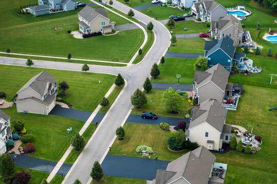 Residential homes in suburban sprawl development in Rochester, New York. Low-density two story private houses in rural suburbs. Housing market in the USA