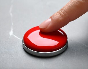 A finger pressing a shiny red button