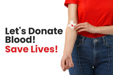 Person in red shirt with bandage on arm promoting blood donation