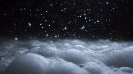 Close up of white foam and bubbles with luminous particles against a dark starry background