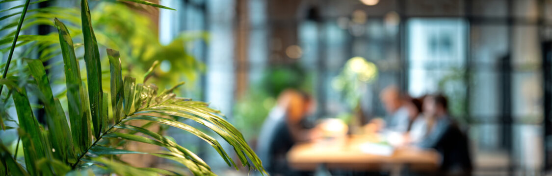 Modern business meeting in a contemporary office with large glass windows and indoor plants, diverse professionals engaged in discussion - Powered by Adobe
