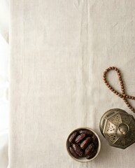 Ramadan Essentials Dates, Traditional Lantern, and Prayer Beads on Linen Fabric