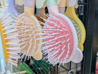 Cute bear ear design hair combs for children displayed on a retail shelf in an accessory shop