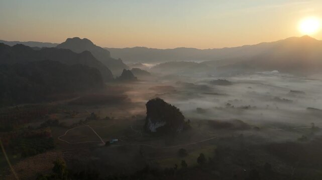 An aerial view of the forest and mountains in a misty morning at Pha Chai Noi, Thailand.