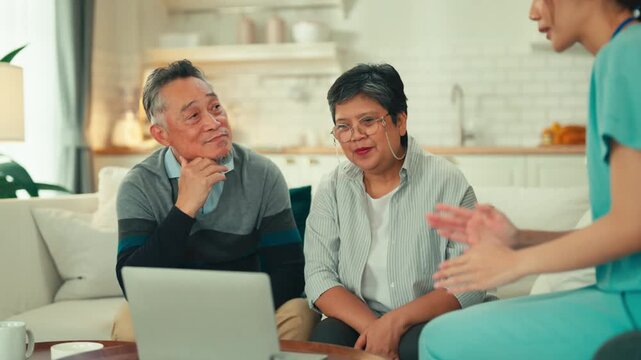 asian female instructor advisor for retirement planning and home insurance senior couple sitting at sofa talking to Female insurance agent financial health retried planing advisor in living room