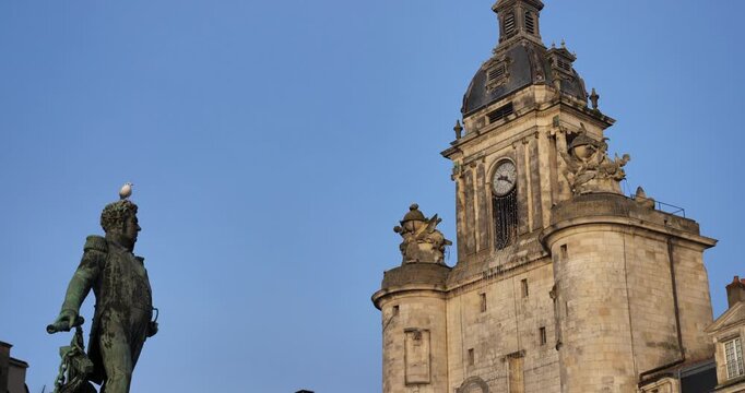 The Grosse Horloge tower and the admiral Duperre statue. La Rochelle,Charente Maritime department, Region Nouvelle Aquitaine, France