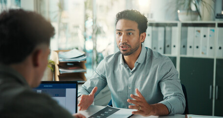 Laptop, job interview and business men in office for meeting, recruitment or finance vacancy. Discussion, documents and male hr manager with candidate for hiring process with resume in workplace.