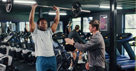 Exercise, coach or people in gym with barbell, guidance or help in weightlifting. Fitness,...