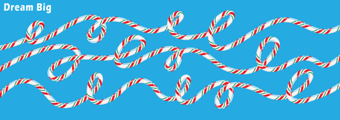 Wavy lines of festive candy canes with inspiring 'dream big' text on a vibrant blue background