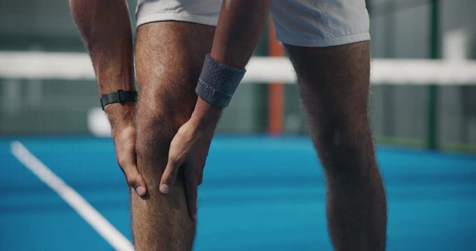 Man, hands or knee pain with injury on tennis court for sport accident, emergency or muscle tension. Closeup, male person or player with sore bone, bruise or strain for joint inflammation or pressure