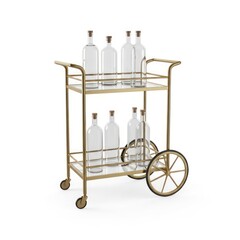A gold bar cart featuring two shelves filled with clear glass bottles sealed with corks. Isolated on a white background, this studio shot highlights the elegant design.