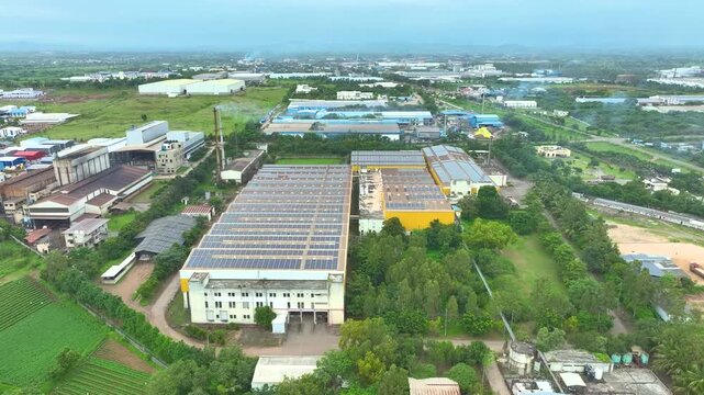 Industrial aerial drone photograph of a textile factory in india showcasing structured factory layout mass production facilities and large manufacturing capacity.