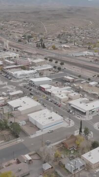 Vertical drone orbit shot circling a Route 66 sign in Kingman Arizona capturing smooth aerial motion classic highway history and travel storytelling