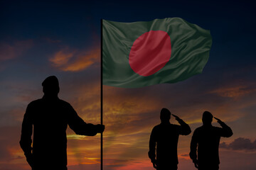 Military mans holds in their hands National flag of Bangladesh