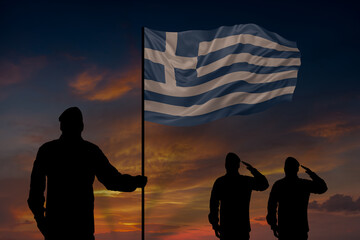 Military mans holds in their hands National flag of Greece