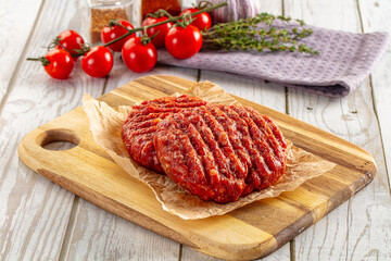 Raw uncoocked red beef round cutlet