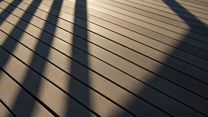 High Contrast Abstract Composite Decking Boards with Geometric Pattern and Strong Midday Shadows
