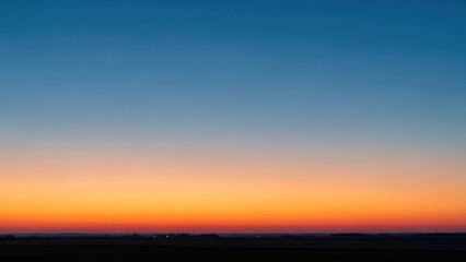Fototapeta premium Gradual color change from blue at top to orange and red near the horizon