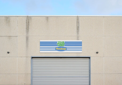 Storefront Sign Mockup on Warehouse Wall