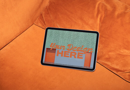 Mockup of Screen Tablet on Orange Couch