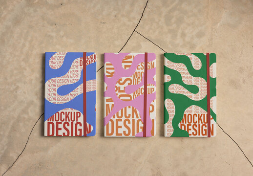 3 Notebooks With Bands Mockup