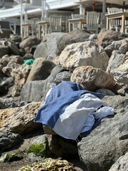  towel on the beach on the rocks