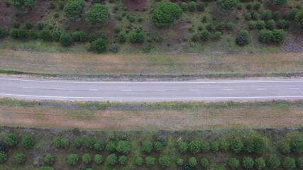 Top down drone view of empty rural road
