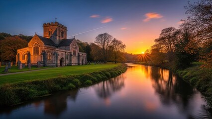 Medieval church by a river at sunset, with autumn foliage
