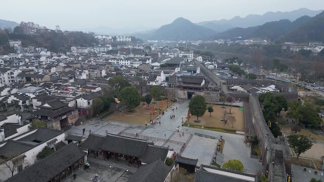 Huangshan, China: Aerial drone footage of the fortified wall and entrance gate of the Huizhou Ancient City in Anhui province in China. 