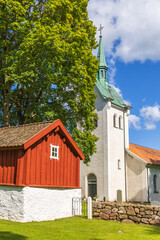 Church and an old shed in the Swedish countryside