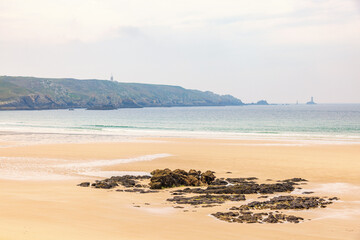 Rocks on a sandy beach by the coast