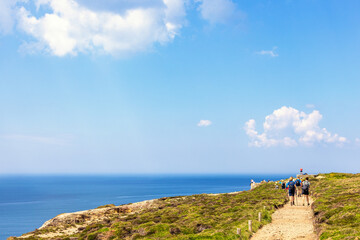 People walking on a path by the sea at Cap de la ch&egrave;vre at Bretagne in France