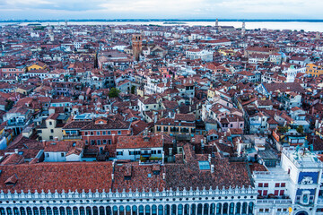 Aerial view of red rooftops and the historic coastline in Venice