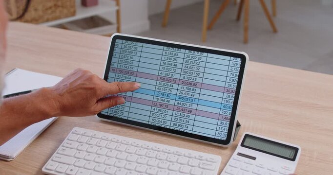 Spreadsheet tablet with finger pointing and calculator on desk, person using digital device for finance data analysis, tracking statistics in accounting budget. Hand of accountant touching screen