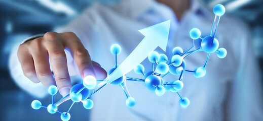 Hand pointing to molecular structure model of chemical compound