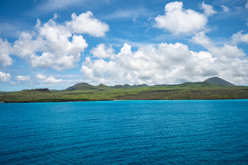 Galapagos Floreana Island Landscape with Green Hills, Sea and Cloudy Sky